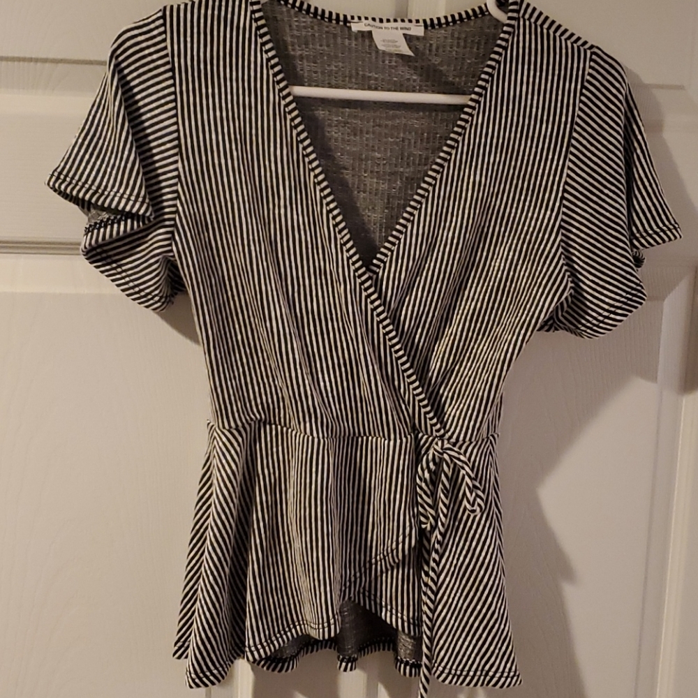 Black and white striped faux wrap peplum top